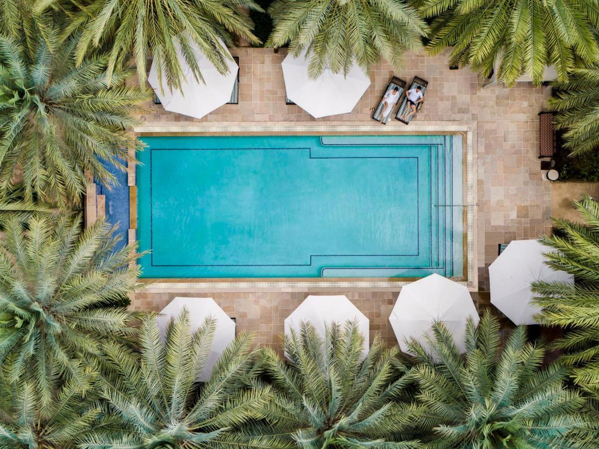فندق جميرا دار المصيف - مدينة جميرا دبي المظهر الخارجي الصورة Aerial view of the pool at the Four Seasons Hotel